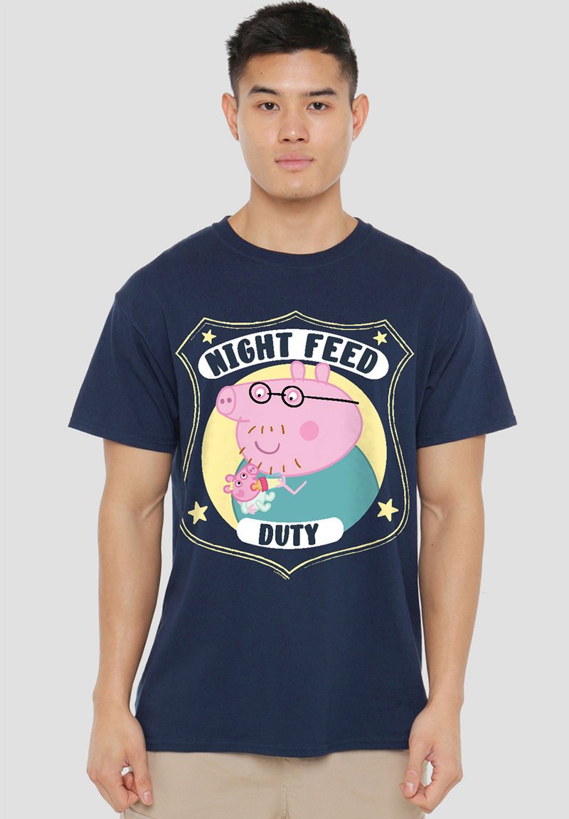 Navy blue t-shirt featuring a cartoon design of a pig wearing glasses with the text "NIGHT FEED DUTY" and a small pig character.