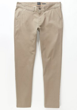 Beige Chinos aus einem Baumwollmischgewebe. Sie verfügen über einen Reißverschluss, Gürtelschlaufen, Vordertaschen und ein gerades Beindesign. Glatte Textur.