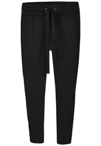 Svarta joggerbyxor i mjuk bomull, med elastisk midja och snörning, samt smalnande muddar vid anklarna.