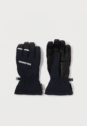 Water-resistant gloves in dark navy and black. Feature a cinched wrist, textured palm, and logo detail in white. Designed for cold weather.