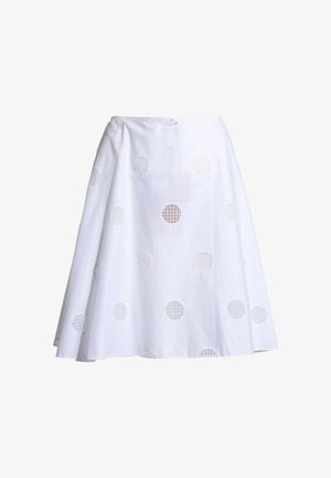 Jupe blanche mi-genou à la forme évasée avec des motifs ronds brodés en découpe uniformément répartis sur le tissu.