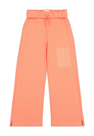 Pantalons de survêtement roses avec jambes larges, taille élastique et cordon de serrage. Présente un détail en texte imprimé blanc sur le côté gauche. Matériau en mélange de coton.