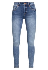 Skinny jeans in light blue denim. Features five pockets, copper hardware, and a faded texture on thighs, with a smooth waistband.