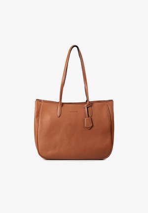 Brown leather tote bag with textured finish, two long handles, and a small detachable tag. Spacious design with a simple, clean silhouette.