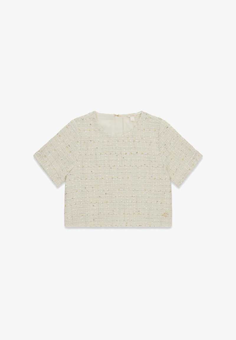 Top corto a maniche corte color crema realizzato in tessuto texturizzato con motivo a quadri, caratterizzato da dettagli in filo dorato e chiusura con zip sul retro.