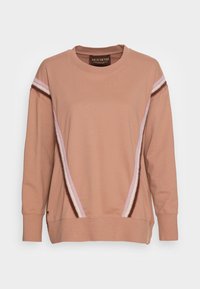 Felpa rosa con collo a giro, maniche lunghe e accenti a strisce diagonali multicolori in morbido tessuto. Caratterizzata da polsini e orlo a coste.