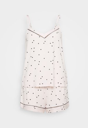 Light pink pajama set with black heart print, featuring a sleeveless top with a V-neck and shorts with a contrasting trim around the hem.