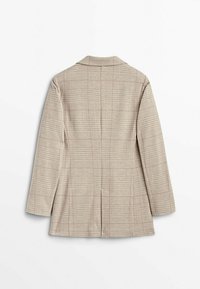 Blazer à carreaux beige avec manches longues et une seule fente au dos, présenté à plat sur un fond blanc.