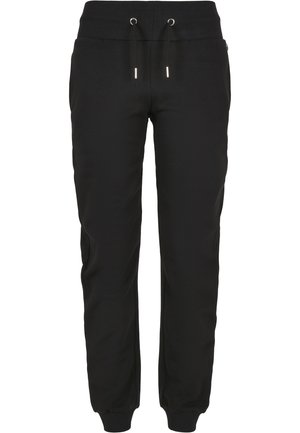 Sorte joggebukser med snøring i livet, ribbede mansjetter og minimalistisk design. Mykt stoff med sidelommer for funksjonalitet.