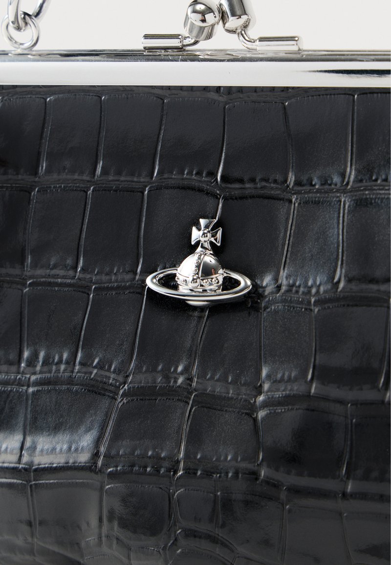 Black faux crocodile leather handbag with a silver clasp and a decorative planet-themed accent. Textured surface with a glossy finish.