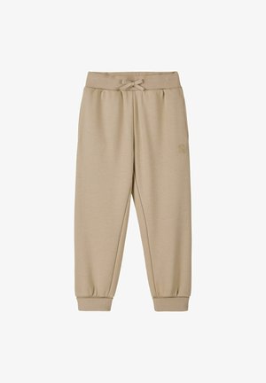 Beige elastic waist jogger pants with drawstring, cuffed ankles, and a small embroidered logo on the right thigh.