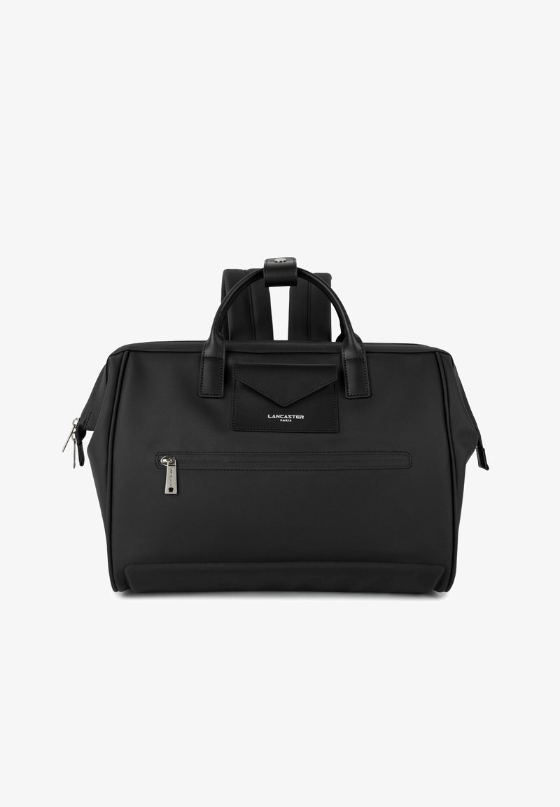 Sac à main Lancaster Paris noir avec doubles poignées, poche zippée à l'avant et bretelles rembourrées visibles sur fond blanc.