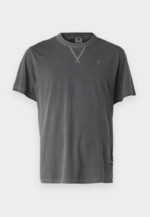 Gray cotton t-shirt with a crew neck, short sleeves, and a textured neckline. Features a small logo on the chest and side hem detail.