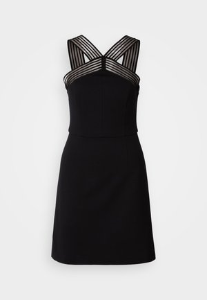 Schwarzes Kleid mit angepastem Oberteil, das transparente gestreifte Details an den Schultern und einen weit ausgestellten Saum aufweist. Glatter Stoff ohne Muster.