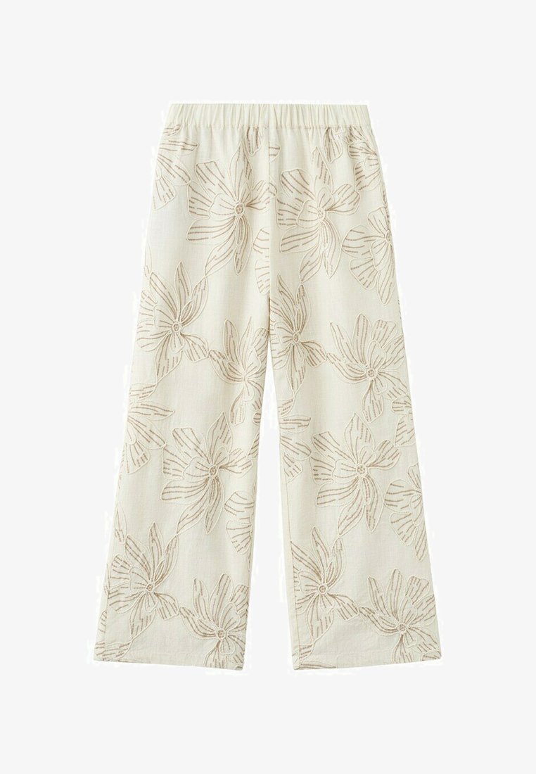 Pantalon large crème avec taille élastique et grand motif de broderie florale marron clair.