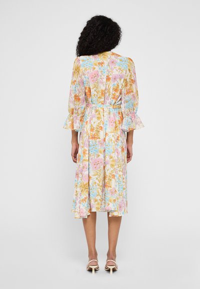 Floral midi dress in pastel colors with ruffled sleeves, cinched waist, and a flared skirt. Features a vibrant print of pink and blue flowers.