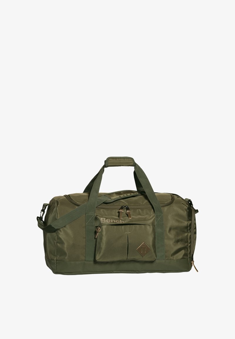 Olijfgroene duffeltas van duurzaam stof, met een voorvak, dubbele handvatten en een afneembare schouderband. Bruine hardware-accenten.