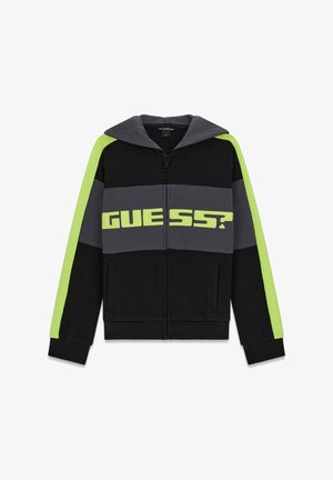 Black zip-up hoodie featuring gray and neon green stripes, large "GUESS?" logo across the chest, and a drawstring hood. Soft fabric texture.
