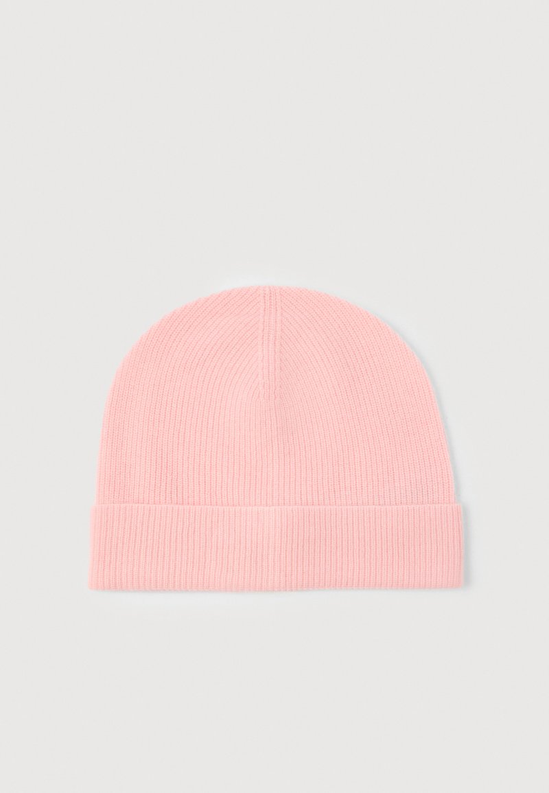 Berretto lavorato a maglia rosa con risvolto. Il tessuto presenta una trama a coste, che offre flessibilità e calore. Finitura liscia.