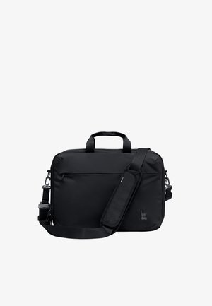 Sort rektangulær blød bærbar taske med øverste håndtag, justerbar skulderrem, front lynlåslomme og "GOT BAG" logo i nederste højre hjørne.