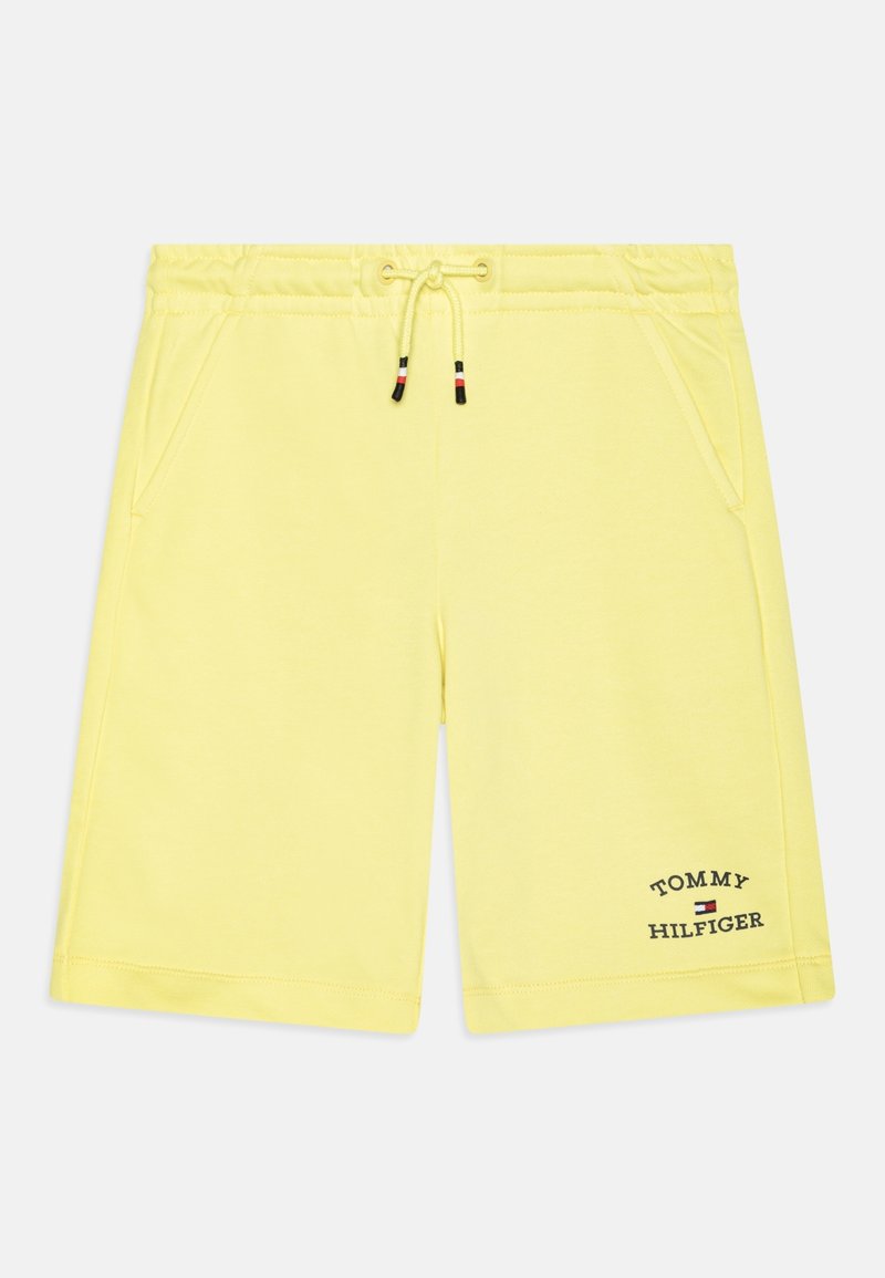 Gele katoenen shorts met een elastische tailleband en trekkoord, voorzien van zijzakken en het "TOMMY HILFIGER" logo op de onderste zoom.