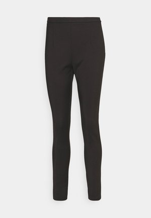 Mustad mustad leggings, mis on täiustatud ja kitseneva disainiga. Valmistatud siledast, venivast kangast, millel on lame vöökoht ja nähtamatud taskud.