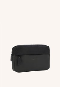 Black rectangular bag featuring a textured fabric upper and a smooth lower section, with a top zipper and subtle logo detail.