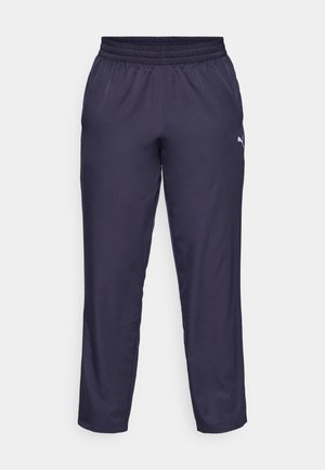 Calças de atletismo de cor navy feitas de tecido leve, apresentando um cós elástico e um pequeno logótipo branco no lado esquerdo. Textura suave.