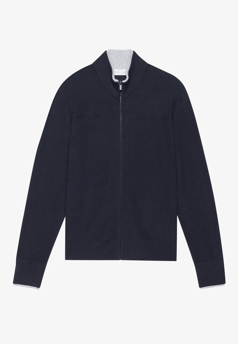 Sweat à zip en bleu marine foncé, avec un design en tricot texturé, un col haut, et une doublure grise contrastante au niveau du col et des poignets.