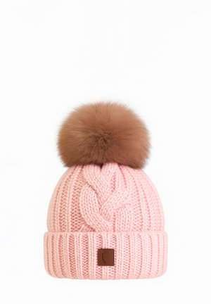 Pink knitted winter hat with a cable pattern and a large brown faux fur pom-pom on top, featuring a small leather patch on the cuff.