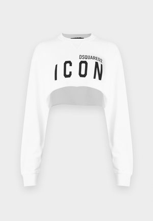 Hvit cropped sweatshirt med lange ermer, rund hals og svart "ICON"-logo på fronten. Laget av et glatt, mykt stoff.