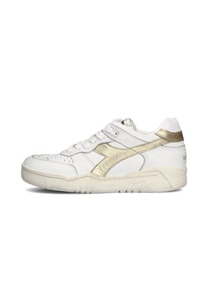 White sneaker featuring a textured upper, gold metallic accents, perforations for breathability, and a rubber sole with a light-colored trim.