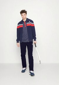 Fila PANTS PRO - Spodnji deli trenirk - navy