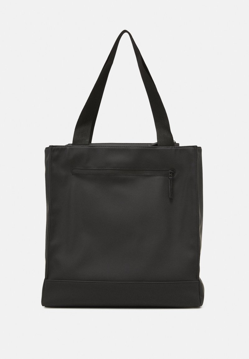 Sac cabas rectangulaire noir avec double anses et une poche zippée à l'avant, présenté sur un fond clair uni.