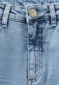 Light blue denim jeans featuring a silver button with a number, contrast stitching, and a zipper closure, showing a faded texture.