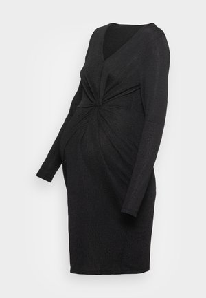 Robe de maternité noire mi-genoux avec manches longues, encolure en V et détail de nœud torsadé à la taille avant.