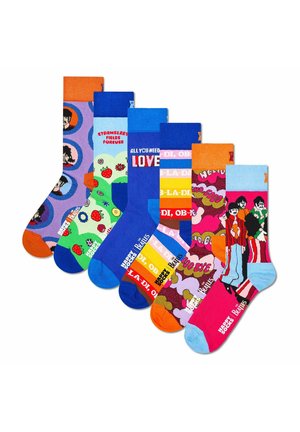 Six colorful socks featuring Beatles-themed designs and phrases, arranged in a fan shape on a white background.
