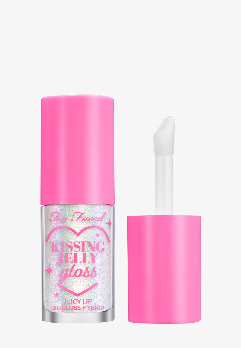 Too Faced Kissing Jelly Gloss heeft een holografische vloeibare formule in een doorzichtige tube met een heldere roze dop en een zachte applicator.