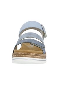 Light blue sandal with two front suede straps and adjustable buckle. Textured insole with light brown edge and white outsole.