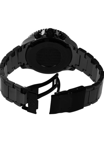 Black metal watch with a link bracelet and a round case. Features a patterned case back and a folding clasp. Smooth, matte finish.