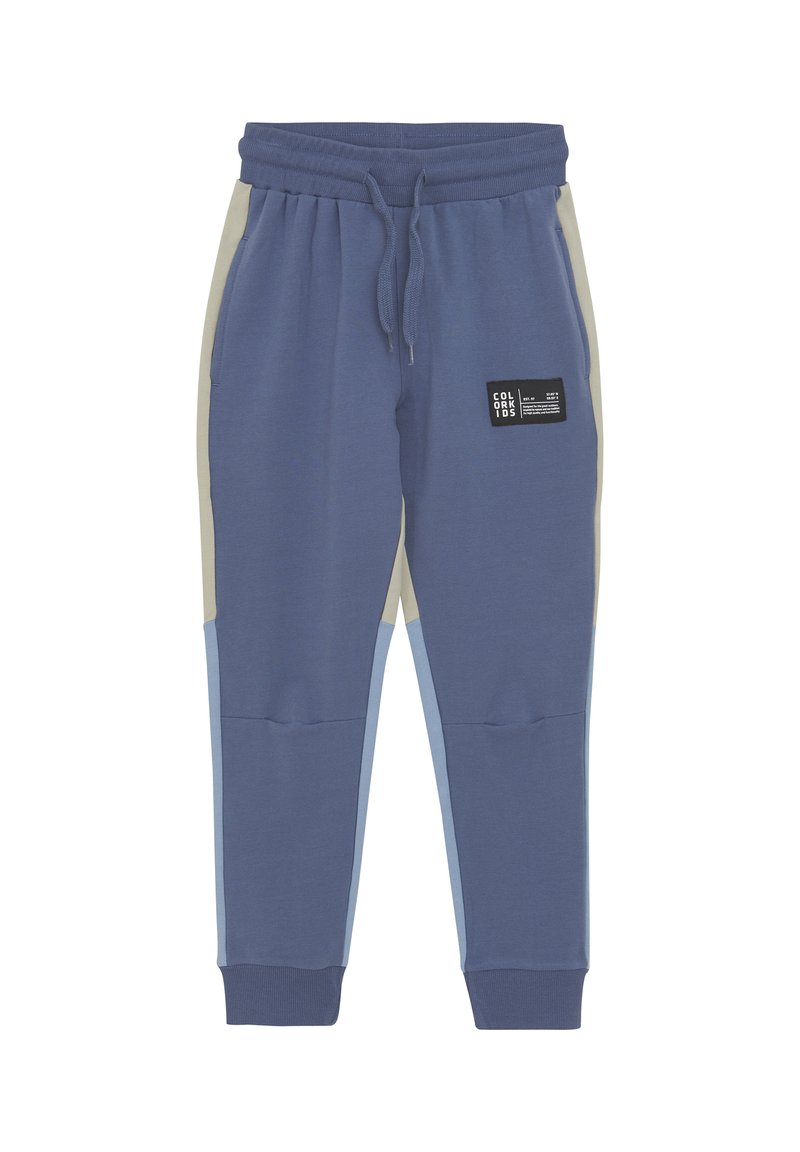 Blå bomullsblandning joggers med beige och ljusblå sidopaneler, elastiskt midjeband med dragsko och en svart varumärkesetikett på framsidan.