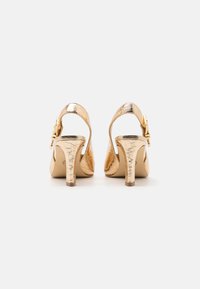 MICHAEL Michael Kors DARRINGTON SLING - Aukštakulniai - pale gold
