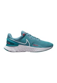 Scarpa da corsa Nike in rete color teal con una suola intermedia bianca. Presenta un accento rosso e un motivo a zigzag distintivo sulla suola. Design di allacciatura standard.