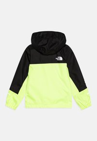 Huvjacka med en svart övre del och en neongul undre del. Tillverkad av lätt material med elastiska ärmslut och logodetalj.