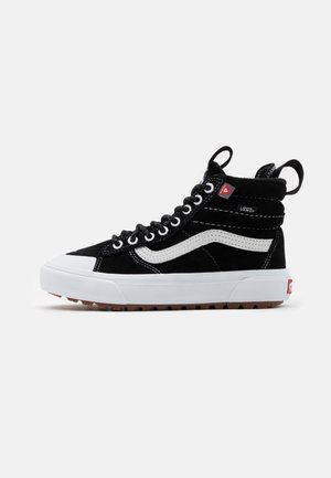 High-top black suede sneakers featuring white accents, a rubber sole, and a padded collar with reinforced eyelets and a logo tag.