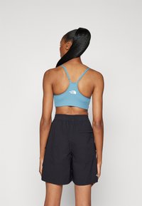 The North Face FLEX BRA - Športni modrček s srednjo podporo - algae blue