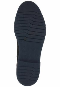 Suela de zapato de goma negra con patrón texturizado, que presenta ranuras horizontales para tracción y detalles de logo y tamaño en relieve.