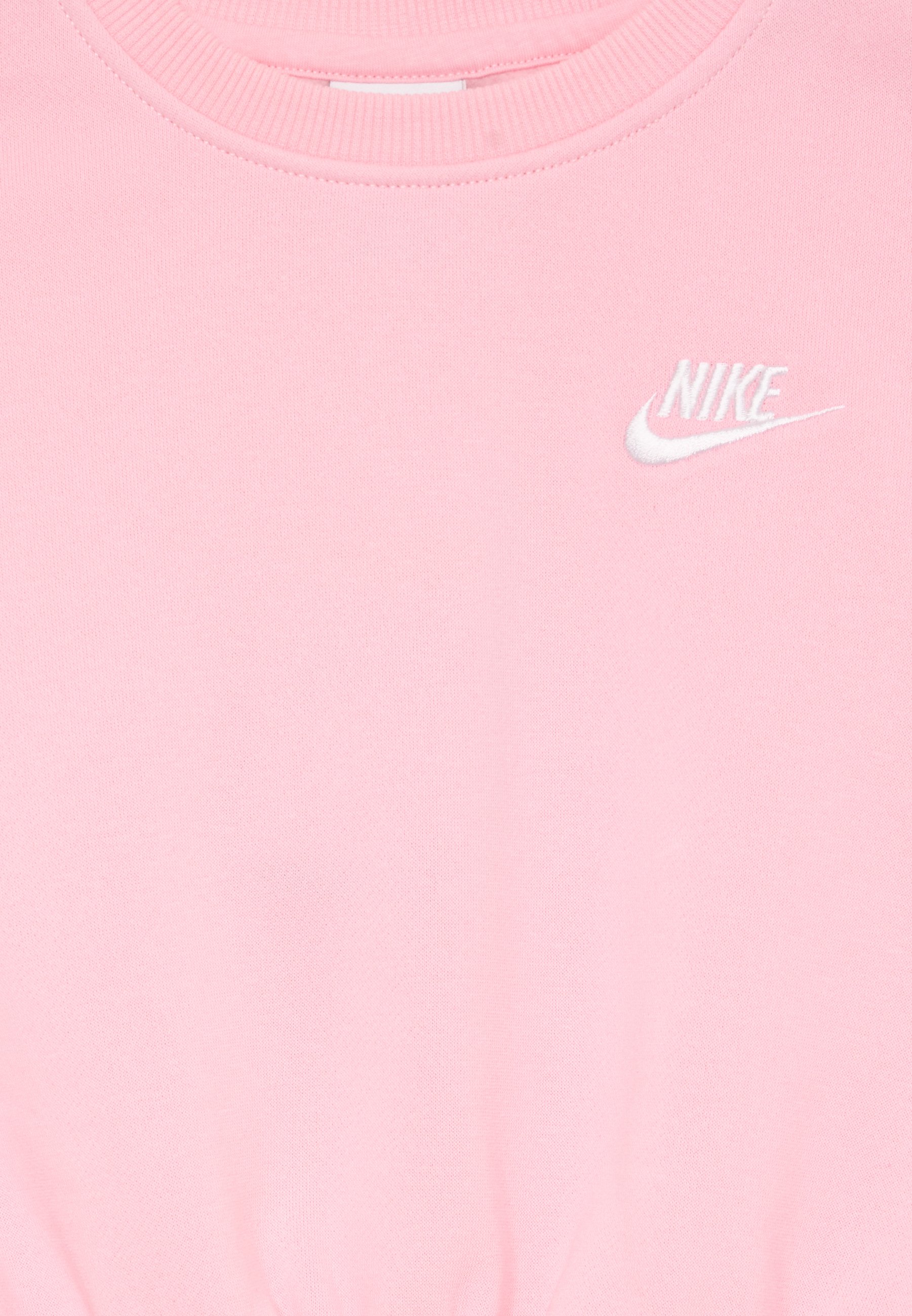 soft pink nike shirt