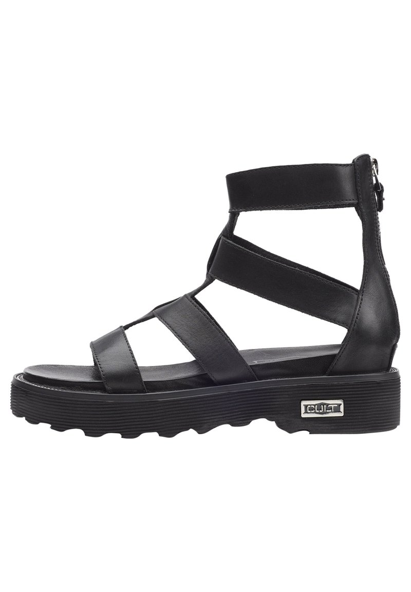 Sandali in pelle nera con molte cinghie incrociate, suola spessa e zip laterale, caratterizzati da un motivo testurizzato e un accento con logo argentato.