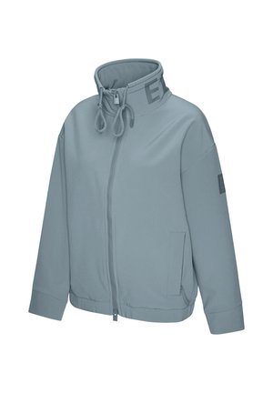 Light blue zip-up jacket with high collar, drawstring, long sleeves, side pockets, and subtle lettering on collar and sleeve.